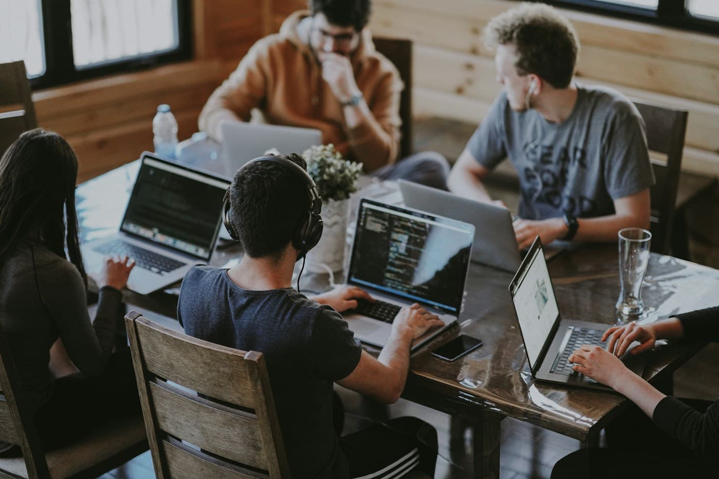 Team collaborating around a table in a shared workspace
